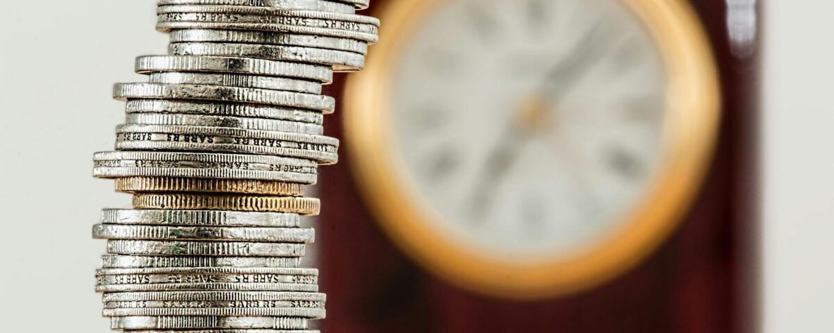 selective focus photo of stacked coins