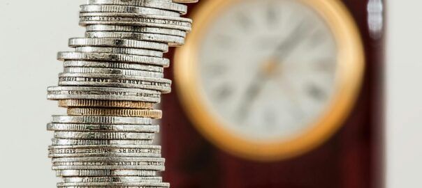 selective focus photo of stacked coins